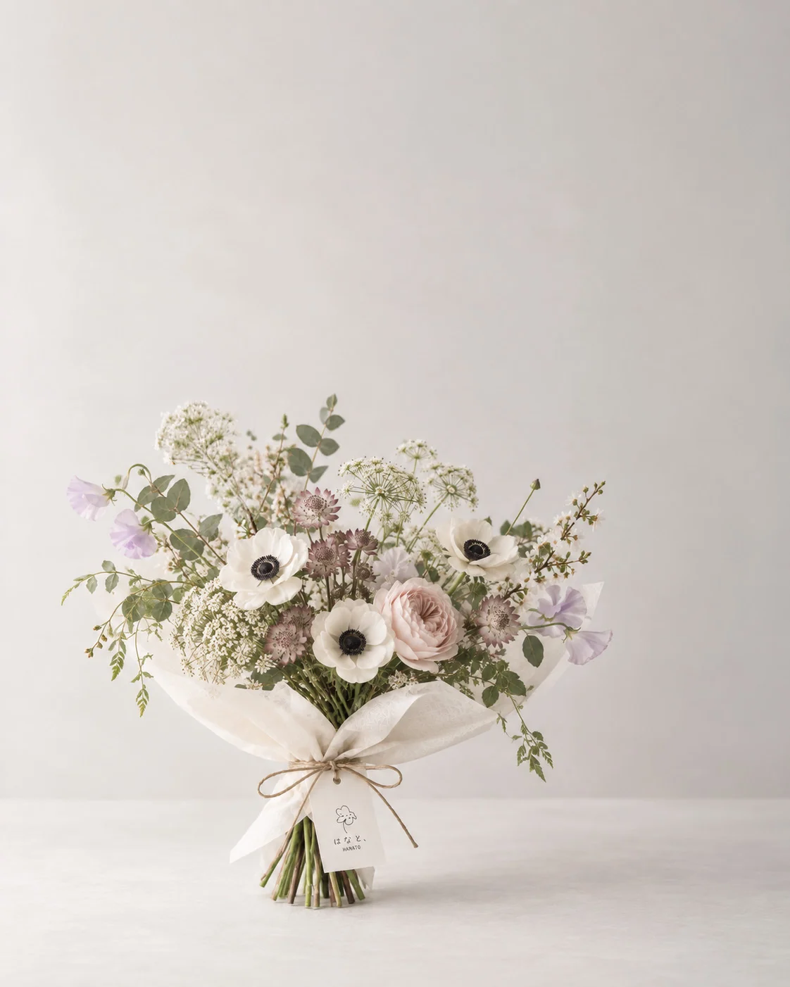 A generous garden bouquet in pale pink and white